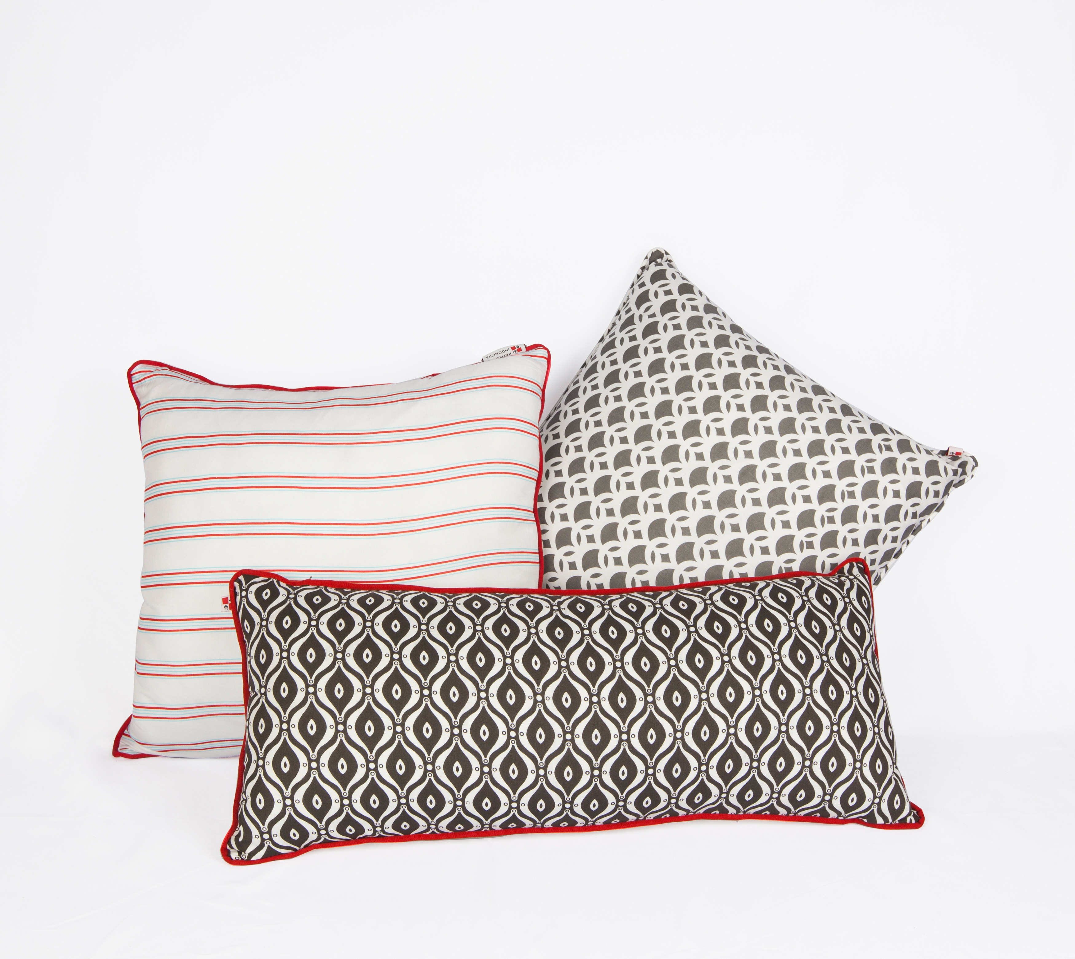 Two Morlinka scented wax tablets hanging from a wooden hanger against a soft fabric background, showcasing elegant and minimal branding.