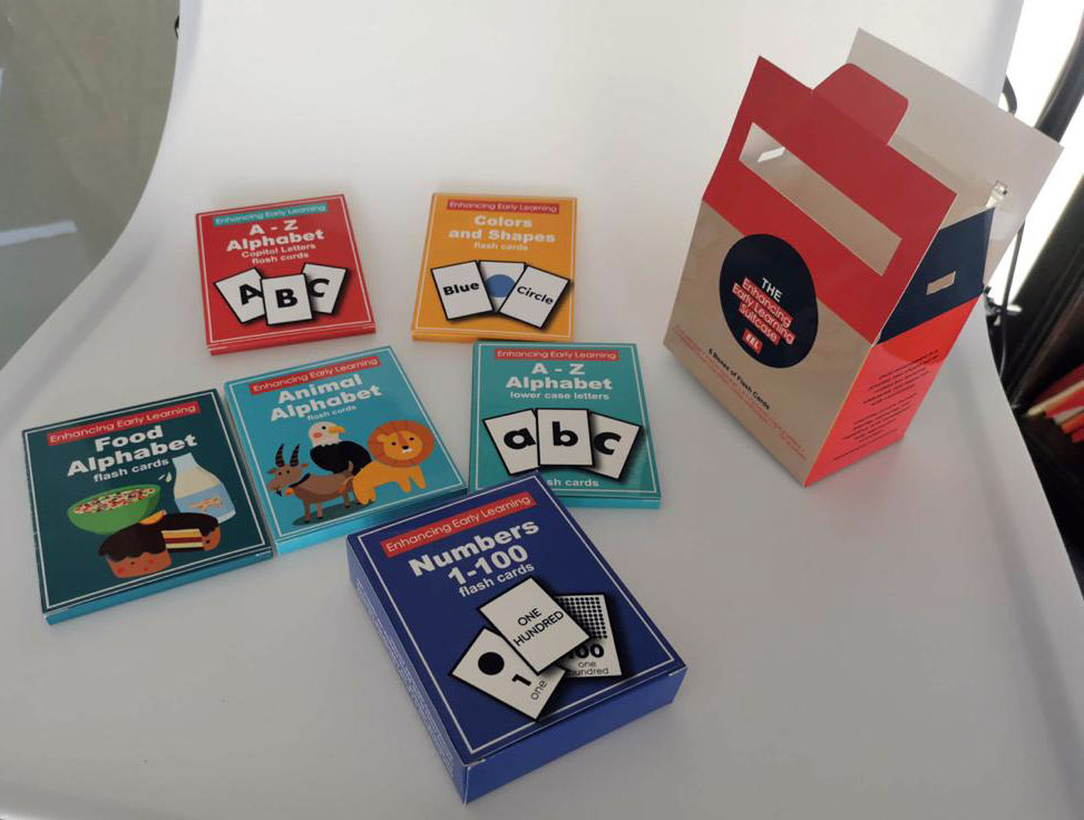 A collection of Morlinka x Yinside Yoga aura mists displayed on white steps, featuring frosted glass bottles with wooden caps and minimalist labels in purple and green tones.