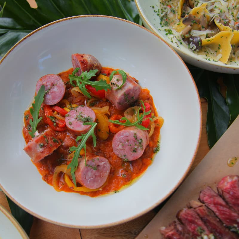 A collection of Morlinka x Yinside Yoga aura mists displayed on white steps, featuring frosted glass bottles with wooden caps and minimalist labels in purple and green tones.