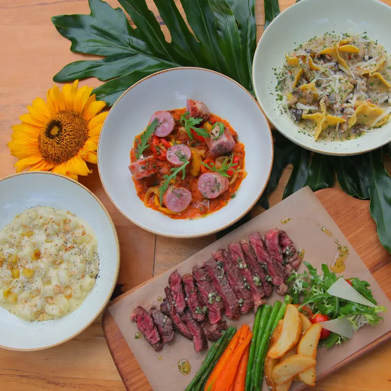 Morlinka “Work in Progress” crystal mist placed among vibrant purple flowers, highlighting its fresh and calming design.